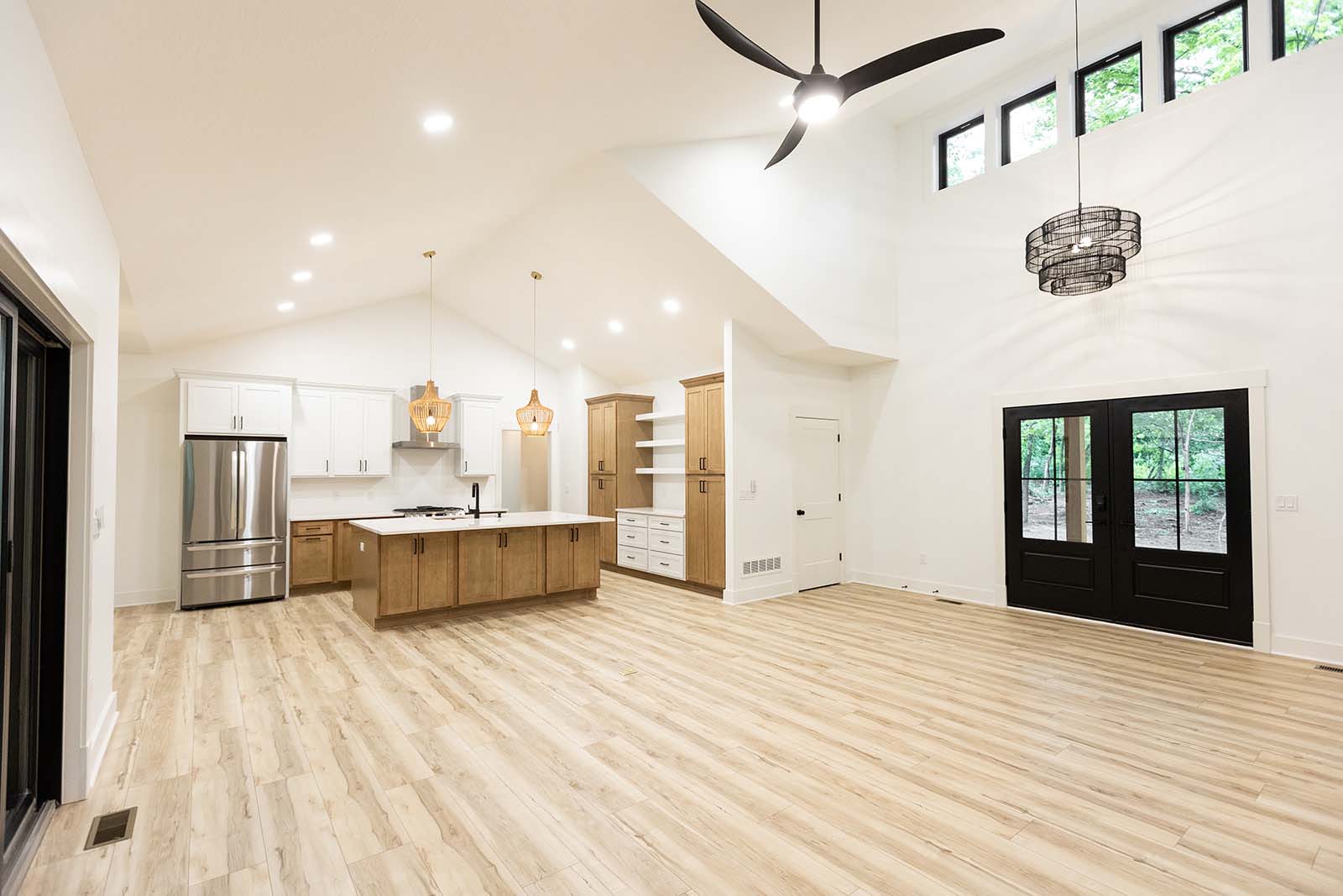 open floor plan, white, high ceilings window panes