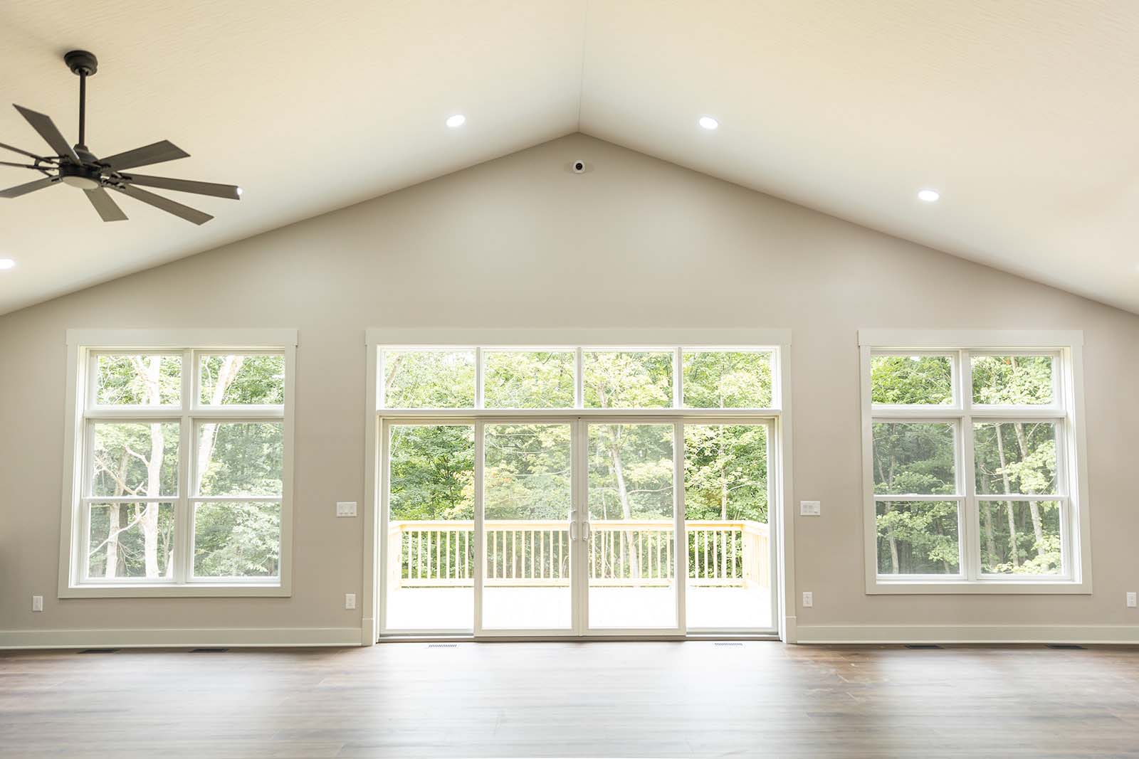 vaulted ceiling. a-frame interior with large white windows